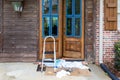 Wooden front door being refinished