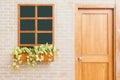 Wooden front door of a home. Front view of a wooden front door on a yellow house. Royalty Free Stock Photo