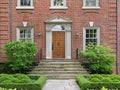 Wooden front door of large brick house Royalty Free Stock Photo