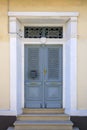 Wooden front door with metal grates