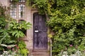 Wooden front door of old stone brick house