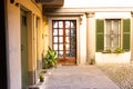 Wooden front door outside old Italian house in Bergamo, Italy Royalty Free Stock Photo