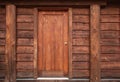 Wooden Front Door in to rustic cabin. Wooden wall with old door. Rustic log cabin with front door in the forest BC Royalty Free Stock Photo