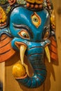 The Wooden of ganesha isolated on wooden background. Colorful Tradition wooden masks and handicrafts on sale at shop