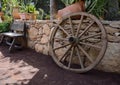 Wooden garden decors, bench and wheel