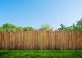 Wooden garden fence at backyard and trees Royalty Free Stock Photo