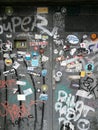 Wooden gate being painted with graffiti