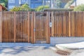 Wooden gate and fence of a residential building with doorbell camera intercom in San Francisco, CA Royalty Free Stock Photo