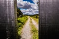 Wooden gate in the foreground and in the background the bucolic image