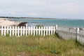 Wooden gate garden with beach ocean and blue sky background