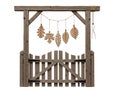 Wooden Gate with Hanging Leaf Decorations in Rustic Garden Setting Royalty Free Stock Photo