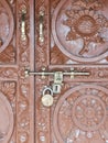 Wooden gate with inlays and bas-reliefs, from the Mustan Valley, Nepal, Royalty Free Stock Photo