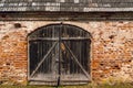 Wooden gate of old building made by red bricks Royalty Free Stock Photo