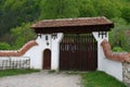 Wooden gate and stone wall