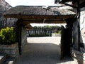 Wooden gate with a thatched roof