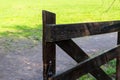 Wooden gate way to ranch old big wicket gate windblown wood on the background of an earthen path pasture Royalty Free Stock Photo