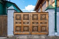 Wooden gates with carvings, vintage looking fence