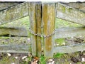 Wooden gates closed by the metal chain