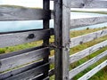 Wooden gates. Lake beyond the gate.