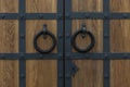 Wooden gates with old metal locks. Historical architecture. Close-up Royalty Free Stock Photo