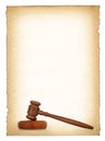 Wooden gavel against old dirty paper background Royalty Free Stock Photo