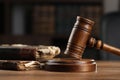 Wooden gavel and antique books on table, closeup Royalty Free Stock Photo