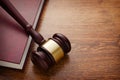 Wooden Gavel and Book on Wooden Table Royalty Free Stock Photo