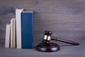 Wooden gavel and books in background. Law and justice concept Royalty Free Stock Photo