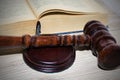 Wooden gavel and books on the table, justice concept Royalty Free Stock Photo