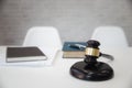 Wooden gavel and books on table in lawyer`s office Royalty Free Stock Photo