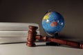 Wooden gavel and globe on the desk. International law and justice court concept Royalty Free Stock Photo