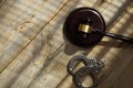 Wooden gavel and handcuff on a wooden surface