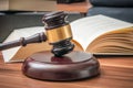 Wooden gavel and opened book in background. Law and justice concept Royalty Free Stock Photo