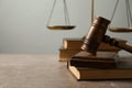 Wooden gavel with scales of justice and books Royalty Free Stock Photo