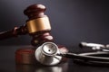 Wooden gavel and stethoscope, close-up view