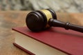 Wooden Gavel on top of a law book in court Royalty Free Stock Photo