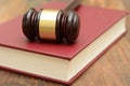 Wooden Gavel on top of a law book in court Royalty Free Stock Photo