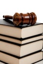 Wooden gavel on top of a stack of law books Royalty Free Stock Photo