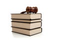 Wooden gavel on top of a stack of law books Royalty Free Stock Photo