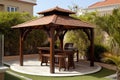 Wooden gazebo with a barbecue area in the courtyard of the house. Generative AI Royalty Free Stock Photo