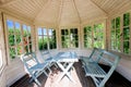 Wooden gazebo inside at sunset on summer evening