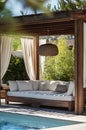Luxury Outdoor Daybed by Poolside with Wooden Pergola and Curtains, Tropical Resort Ambiance Royalty Free Stock Photo