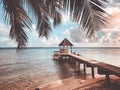 Wooden gazebo on pier. Tropical island beach Royalty Free Stock Photo