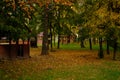 Wooden gazebos in the park on an autumn day no people,summerhouse in the forest with wonderful autumn orange red and Royalty Free Stock Photo