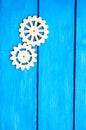 Wooden gears ,cogwheel, on a blue background, mechanism Royalty Free Stock Photo