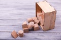 Wooden geometric figures in the wooden box. Education concept. Royalty Free Stock Photo