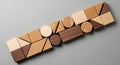 Wooden geometric shapes arranged in a Royalty Free Stock Photo