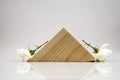 Wooden geometrical pieces with white roses