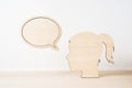 Wooden girl silhouette head with dialogue frame