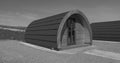 Wooden Glamping pod in a glamping village with yurts and gravel paths Ireland